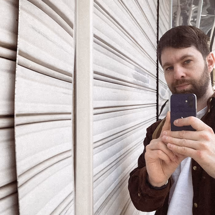 Artem Sapegin is making a photo with a phone